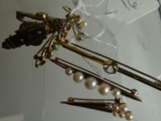 A parcel of seven brooches comprising two 9ct yellow gold and pearl examples at 6.27gms total, two