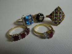 A parcel of four various 9ct yellow gold rings; together with an 18ct yellow gold ruby and diamond