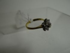 An 18ct yellow gold thirteen-diamond cluster ring, 2.71gms
