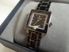 A boxed Fendi Swiss-made wristwatch in black stainless steel and having a square dial decorated with