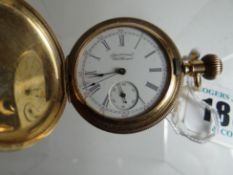 A 14k yellow gold guilloche decorated full-hunter pocket watch, having a white enamel dial bearing