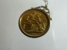 A gold full-sovereign in a 9ct pendant mount