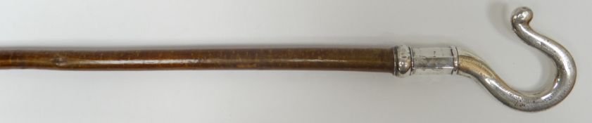 A silver-handled ceremonial ‘shepherd’s
crook’, on a non-matching staff, Chester silver 1845,