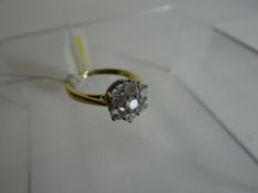 An 18k yellow gold floral seven stone diamond cluster ring