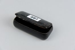 An oblong papier mache lidded snuff/tobacco box with delicate pewter inlay