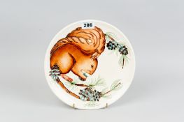 A Moorcroft pottery limited edition (276/500) 1995 year plate, boxed and with certificate, a cream