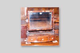 A Regency crossbanded mahogany swing toilet mirror with bow fronted base, three box wood strung