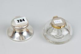 A circular plain silver inkwell with glass liner, Birmingham 1988 and a glass inkwell with white
