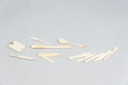 A good parcel of small ivory items including a needle case card as a parasol, an Edwardian weekly