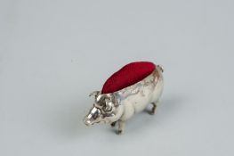 A pin cushion - a silver pin cushion in the form of a standing pig, 0.4 ozs gross, Birmingham 1907