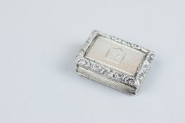 A vinaigrette - an early Victorian oblong silver vinaigrette with scrolled and lined edging and