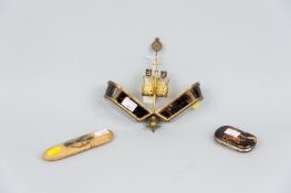 A tortoiseshell and bevelled glass scent container, hinge opening to reveal a gilt metal holder with