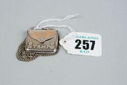 A stamp case - a silver stamp case and chain, 0.25 ozs, Birmingham 1904