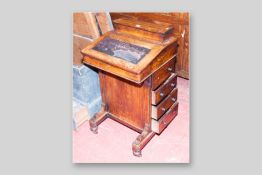 A Victorian walnut and boxwood line inlaid Davenport with four side drawers and four opposing