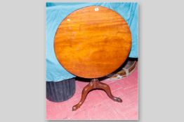 A Georgian mahogany circular tilt top table on turned column and splayed triple support, 30 ins (