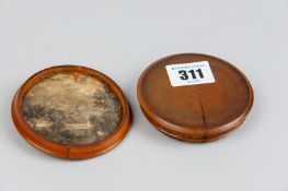 A rare George III circular fruit wood or yew snuff box, the lid with a raised bust of George III