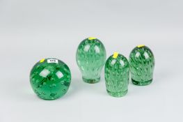 Four various Victorian glass dumps, assorted shapes with bubble inclusions