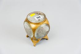 A Victorian bevelled glass and gilt metal casket, the circular bevelled edge panels etched with