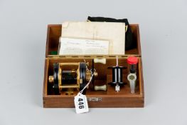 An Abu Ambassador Deluxe 5000 fishing reel with black anodized spool, star drag housings and