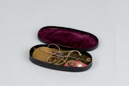 A set of brass and steel travelling scales in an oval tinware box