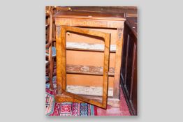 A Victorian walnut and inlaid single glazed door side cabinet with cast metal embellishments on a
