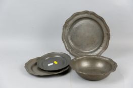 Two early English pewter plates with shaped edge, a matching bowl 2.25 x 9 ins (5.5 x 23 cms),