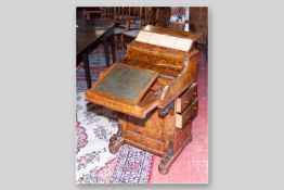 A Victorian burr walnut piano top Davenport with spring top letter rack, the curved fall opening