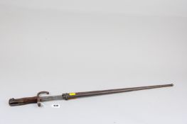 A French Gras bayonet, the straight blade marked to the top St Etienne, dated 1880 with metal