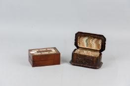 A mahogany lidded box opening to become a multi-wood inlaid cribbage board with inset bone