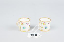 A pair of miniature Minton china floral decorated mugs
