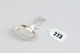 A caddy spoon - a Georgian silver caddy spoon, the bowl with leaf decoration and having a curved