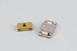 An Edwardian brass thread counter and a white metal thread counter