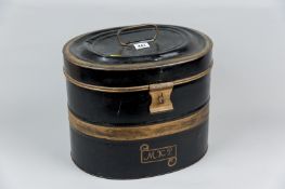 A Victorian tin hat box with carrying handle, 10.5 x 13 ins (26.5 x 33 cms)