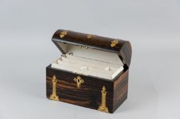 A late Victorian dome topped Coromandel stationery box with Gothic gilt metal mounts and