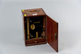 An early 20th Century mahogany cased brass microscope by Aronsberg & Co, Castle Street, Liverpool,
