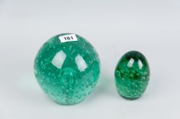 A Victorian green bubble glass dump weight, 5 x 5 ins (12.5 x 12.5 cms) along with a smaller