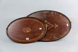 An Edwardian mahogany oval galleried tray with twin brass carrying handles, central inlaid panel