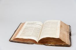 A Dutch/Flemish leather bound copy of the New Testament with gilt tooled spine and brass and leather