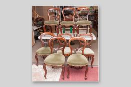 A good set of six Victorian mahogany balloon back chairs with shield shaped cartouche on central
