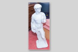 A reconstituted garden statue, classically styled of a man standing before a block pillar on a