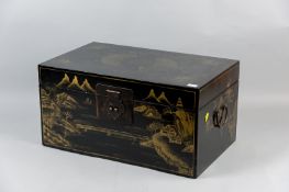 A 20th Century Oriental export black lacquer and gilt decorated lidded deed box with iron carrying