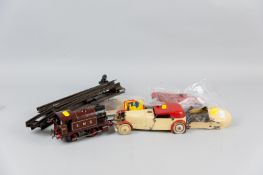 A quantity of early Meccano kit and instructions for airplanes and cars, some part built and a