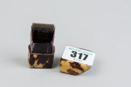 A tortoiseshell needle case with the name 'John James & Sons, Redditch, Prize Needles Inside'