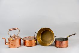 A Victorian copper kettle and twin iron handled brass preserve pan along with two early copper pans