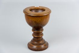 A treen font, the turned hardwood vessel with removable circular top and dished copper inset bowl,
