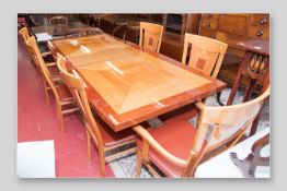 A quality modern dining table and six (four plus two) chairs, a multi-wood quarter veneered