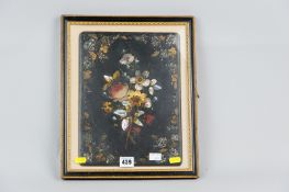 A framed Victorian papier mache panel of hand painted flowers with gilt highlighting and