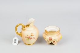 A Royal Worcester blush ground pinched jug with floral and gilt highlighted decoration and gilt