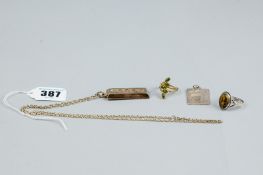 A silver signet ring with oval Mona Lisa, a gold plated silver ingot with chain, a Silver Jubilee