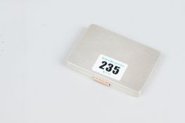 A card case - an engine turned oblong silver card case with gilt interior, 3.3 ozs, Birmingham 1940